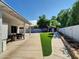 Expansive backyard featuring artificial turf, concrete patio, and a gazebo at 5255 W Cochise Dr, Glendale, AZ 85302