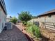 Spacious backyard with desert landscaping and mature greenery at 5255 W Cochise Dr, Glendale, AZ 85302
