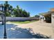 Large concrete patio area with synthetic grass perfect for outdoor entertaining at 5255 W Cochise Dr, Glendale, AZ 85302