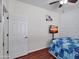 Cozy bedroom featuring stylish accent wall, ceiling fan, and mounted television at 5255 W Cochise Dr, Glendale, AZ 85302