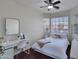 Bright bedroom featuring wood floors, a window and work space at 5255 W Cochise Dr, Glendale, AZ 85302