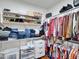 Walk-in closet featuring built-in shelving and hanging racks for ample storage at 5255 W Cochise Dr, Glendale, AZ 85302