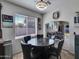 Well lit dining area with large window and access to other areas of the home at 5255 W Cochise Dr, Glendale, AZ 85302