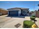 Charming single-story home featuring a well-maintained yard and an attached two-car garage at 5255 W Cochise Dr, Glendale, AZ 85302