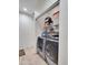 Bright laundry area with shelving and stainless steel, front-loading washer and dryer at 5255 W Cochise Dr, Glendale, AZ 85302