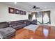 Spacious living room with a ceiling fan, hardwood floors, and natural light at 5255 W Cochise Dr, Glendale, AZ 85302