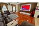 Spacious living room with hardwood floors, comfortable seating, and a modern entertainment center at 5255 W Cochise Dr, Glendale, AZ 85302