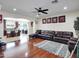 Spacious living room featuring hardwood floors, open archway to the kitchen, and neutral walls at 5255 W Cochise Dr, Glendale, AZ 85302