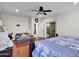 View of main bedroom showcasing hardwood floors, ceiling fan, and sliding glass door at 5255 W Cochise Dr, Glendale, AZ 85302