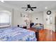 View of main bedroom showcasing hardwood floors, ceiling fan, and built-in bathtub at 5255 W Cochise Dr, Glendale, AZ 85302