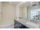 Bathroom features a double sink, granite countertops, dark cabinets, and a bathtub with a shower at 615 E Portland St # 160, Phoenix, AZ 85004