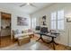 Bright bedroom or office space with a ceiling fan, plantation shutters, and neutral decor at 615 E Portland St # 160, Phoenix, AZ 85004