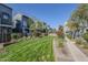 Well-maintained community lawn and landscaping between modern condo buildings on a sunny day at 615 E Portland St # 160, Phoenix, AZ 85004