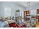 Open concept living room featuring a kitchen island, hardwood floors, recessed lighting, and modern furnishings at 615 E Portland St # 160, Phoenix, AZ 85004