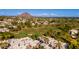 Stunning aerial view showcasing the golf course, community, and Camelback Mountain in the background at 6229 N 30Th Way, Phoenix, AZ 85016