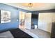 Comfortable bedroom with ample closet space and stairs in view of the doorway at 6229 N 30Th Way, Phoenix, AZ 85016
