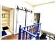 Hallway featuring stylish barn doors leading to a shower and blue banister at 6229 N 30Th Way, Phoenix, AZ 85016