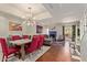 Open-concept living and dining area with modern lighting, stylish furniture, and a cozy fireplace at 6229 N 30Th Way, Phoenix, AZ 85016