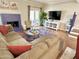 Cozy living room featuring a blue painted fireplace, plush sofa, and a patio door at 6229 N 30Th Way, Phoenix, AZ 85016