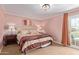 Cozy main bedroom featuring soft carpet, warm colors, and a private balcony at 6229 N 30Th Way, Phoenix, AZ 85016