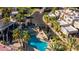 Aerial view of a community pool area featuring comfortable lounge chairs and mature palm trees for a relaxed oasis at 6229 N 30Th Way, Phoenix, AZ 85016