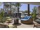 Lounge area by the pool with comfortable seating, stylish decor, and views of a waterslide at 6229 N 30Th Way, Phoenix, AZ 85016