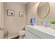 Stylish powder room featuring patterned wallpaper, modern fixtures, and an elegant marble countertop at 6229 N 30Th Way, Phoenix, AZ 85016