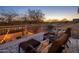 Relaxing balcony with comfortable lounge chairs and decorative string lights, perfect for enjoying the sunset at 7501 E Phantom Way, Scottsdale, AZ 85255