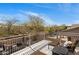 Relaxing balcony offers outdoor seating and a view of the well-maintained backyard and landscaping at 7501 E Phantom Way, Scottsdale, AZ 85255