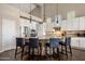 Gourmet kitchen with granite countertops, stainless steel appliances, and a breakfast bar at 7501 E Phantom Way, Scottsdale, AZ 85255