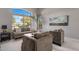 Cozy living room with a large window, comfortable seating, and a modern lamp at 7501 E Phantom Way, Scottsdale, AZ 85255