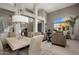 Open living space with dining table, view of the staircase, and seating area at 7501 E Phantom Way, Scottsdale, AZ 85255