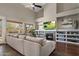 Spacious living room with fireplace, built-ins, and sliding glass doors to patio at 7501 E Phantom Way, Scottsdale, AZ 85255