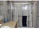 Bathroom featuring an enclosed shower with glass doors and granite countertops at 7807 E Main St # F24, Mesa, AZ 85207
