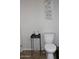 Cozy bathroom features decorative wall art above a standard toilet at 7807 E Main St # F24, Mesa, AZ 85207