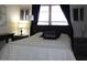 Bedroom featuring queen-sized bed, dark furnishings and window at 7807 E Main St # F24, Mesa, AZ 85207