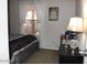 Bedroom featuring a neutral color scheme, blinds, and mirror at 7807 E Main St # F24, Mesa, AZ 85207