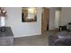 Cozy carpeted living room view into kitchen at 7807 E Main St # F24, Mesa, AZ 85207