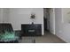 Carpeted living room with open doorway and dark furniture at 7807 E Main St # F24, Mesa, AZ 85207