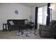 Comfortable living room with neutral tones, a plush sofa, and an accent rug at 7807 E Main St # F24, Mesa, AZ 85207