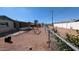 Spacious backyard with a swing set, gravel landscaping, and a partial fence, offering a Gathering-friendly outdoor space at 1116 E 11Th E St, Casa Grande, AZ 85122