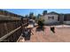 The backyard is gravel-filled with landscaping and a privacy fence at 1116 E 11Th E St, Casa Grande, AZ 85122