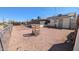 Spacious backyard with gravel, fence, and an enclosed sunroom at 1116 E 11Th E St, Casa Grande, AZ 85122