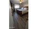Cozy bedroom with a full-sized bed, large window, and new flooring at 1116 E 11Th E St, Casa Grande, AZ 85122