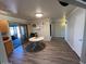 Bright dining area features wood-look floors and a sliding door to the outdoors at 1116 E 11Th E St, Casa Grande, AZ 85122