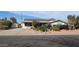 Charming home features solar panels, well-kept landscaping, and a spacious driveway at 1116 E 11Th E St, Casa Grande, AZ 85122