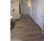 Hallway featuring modern flooring that complements the home's design and layout at 1116 E 11Th E St, Casa Grande, AZ 85122