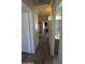 Hallway with storage and an updated bathroom and bedroom at 1116 E 11Th E St, Casa Grande, AZ 85122