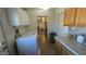 A convenient laundry area featuring updated appliances and cabinetry at 1116 E 11Th E St, Casa Grande, AZ 85122