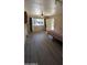 Bright living area with large window and new flooring at 1116 E 11Th E St, Casa Grande, AZ 85122